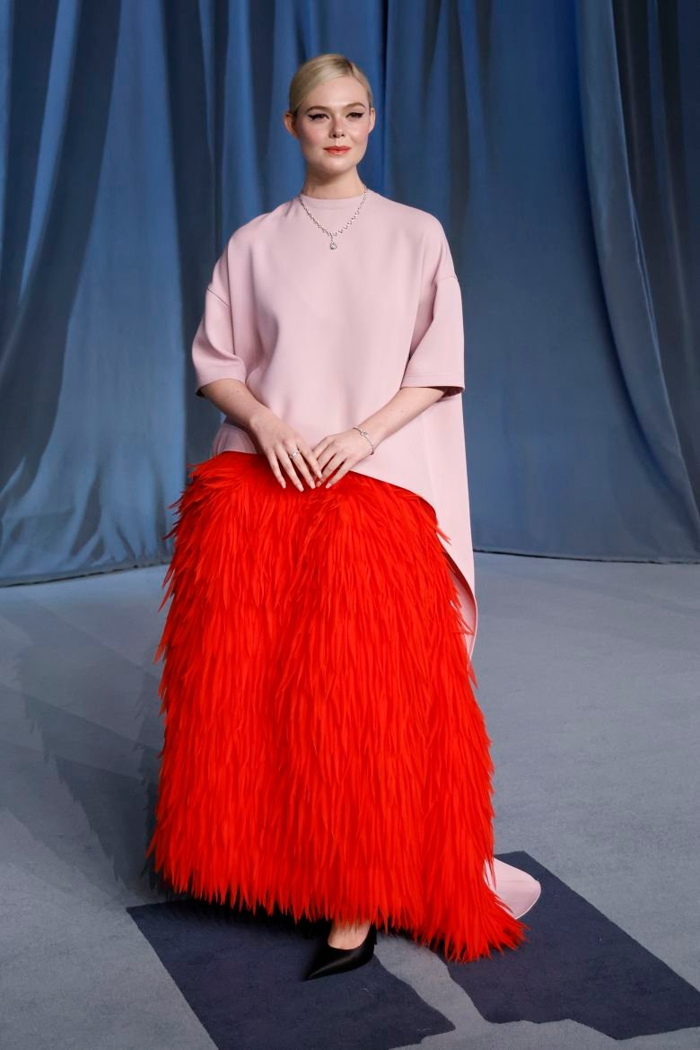 Elle Fanning in a full feathered outfit by Balenciaga.
