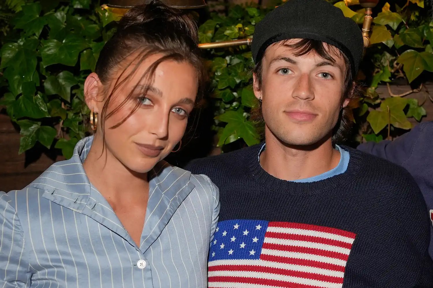 Emma Chamberlain, Peter McPoland (C) and guest at An Evening at Ralph's held at Ralph's Restaurant on July 27, 2024 in Paris, France.