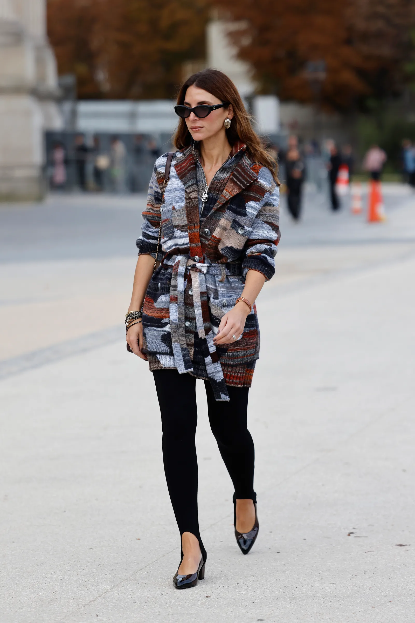 PARIS FRANCE  OCTOBER 01 A guest wears blue brown cream decorated knitted cardigan black leggings black heels outside...
