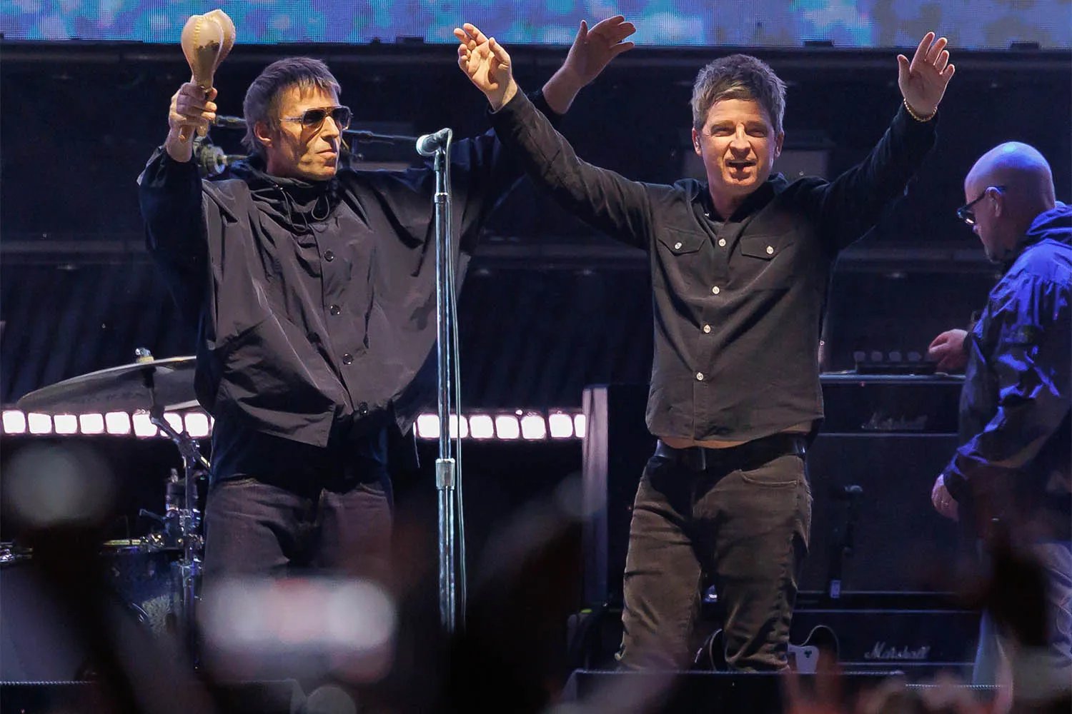 Liam Gallagher and Noel Gallagher performing in September 2025 in Pasadena, California.