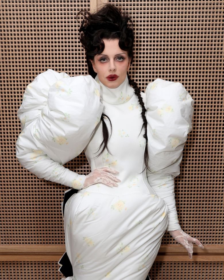 Julia Fox in London wearing a dramatic Marc Jacobs gown that called back to when sleeves were padded for extra height.