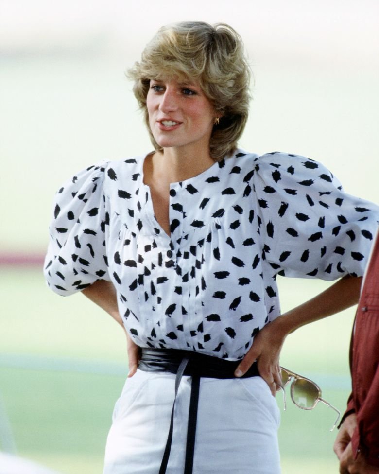 Princess Diana often wore puff sleeves, including on her wedding day, but in 1983, watched a polo match in a more casual take on the style.