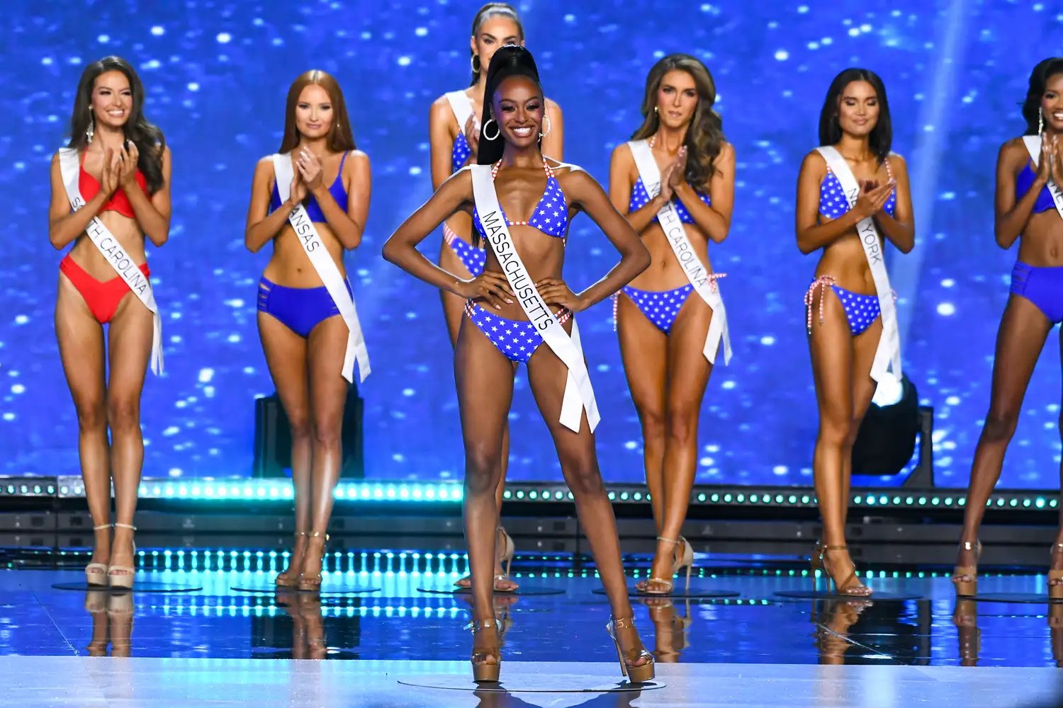 Kleo Torres, Miss District of Columbia USA, Gracen Grainger, Miss South Carolina USA, Bella Whitlock, Miss Kansas USA, Christell Foote, Miss Tennessee USA, Melissa Sapini, Miss Massachusetts USA, Kenzie Halsey, Miss North Carolina USA, Marizza Delgado, Miss New York USA and Najah Ali, Miss Nevada USA walk onstage during the 73rd annual Miss USA Pageant at Peacock Theater on August 4, 2024, in Los Angeles, California.