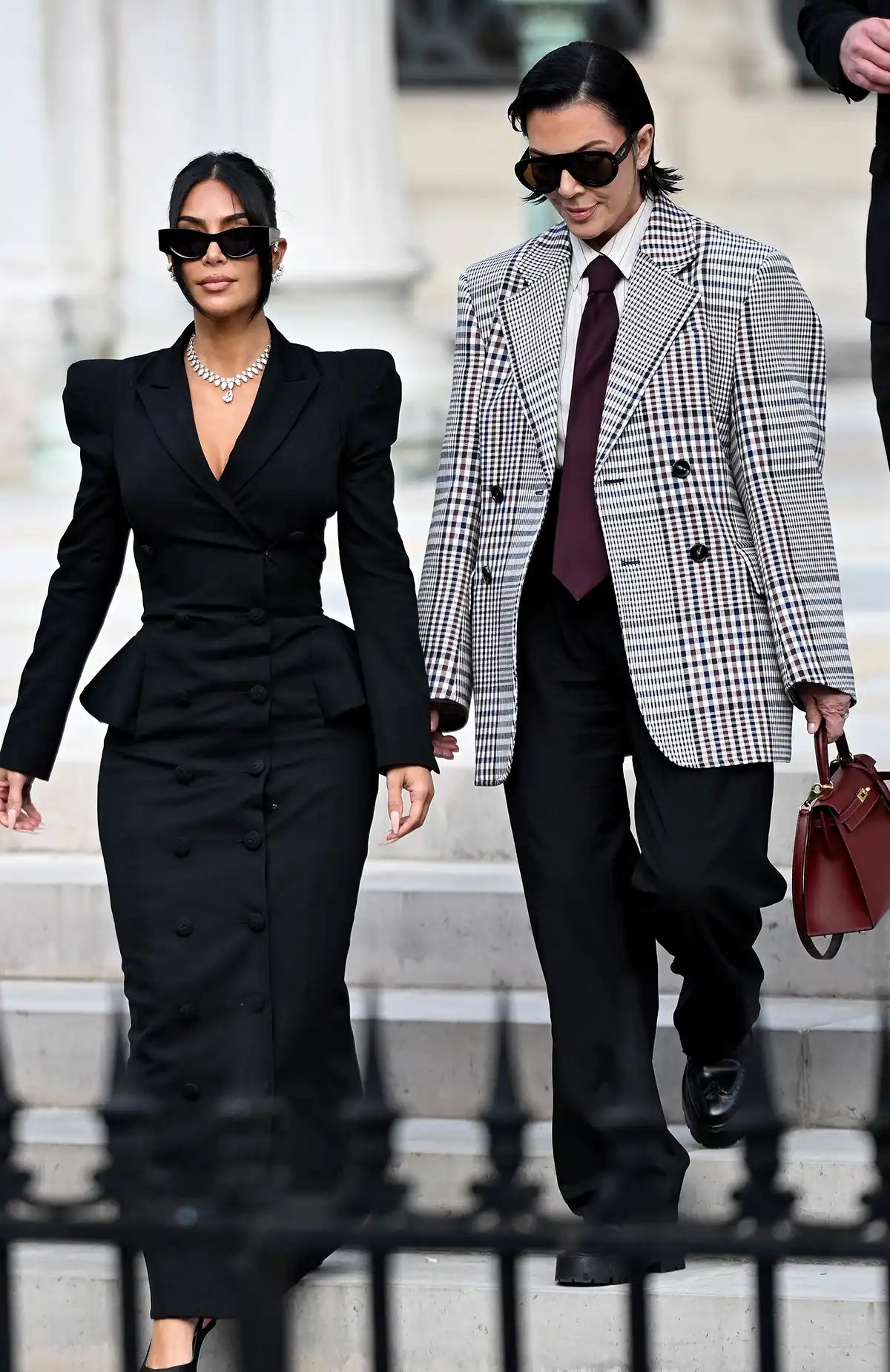 Kim Kardashian leaves with her mother Kris Jenner after testifying in court about the 2016 robbery, May 13, 2025.