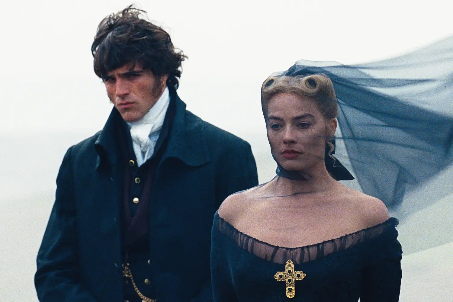  JACOB ELORDI as Heathcliff and Actor, Producer MARGOT ROBBIE as Catherine Earnshaw in Wuthering Heights