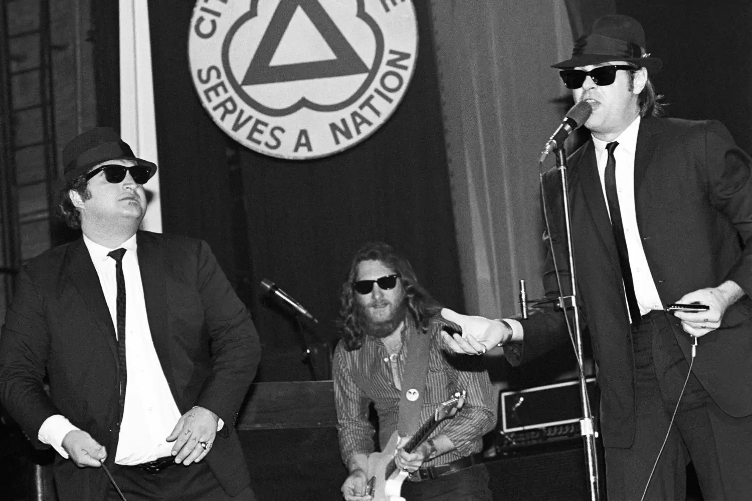 Dan Aykroyd and John Belushi with Steve Cropper in back performing with The Blues Brothers at the Palladium in New York City on June 1, 1980