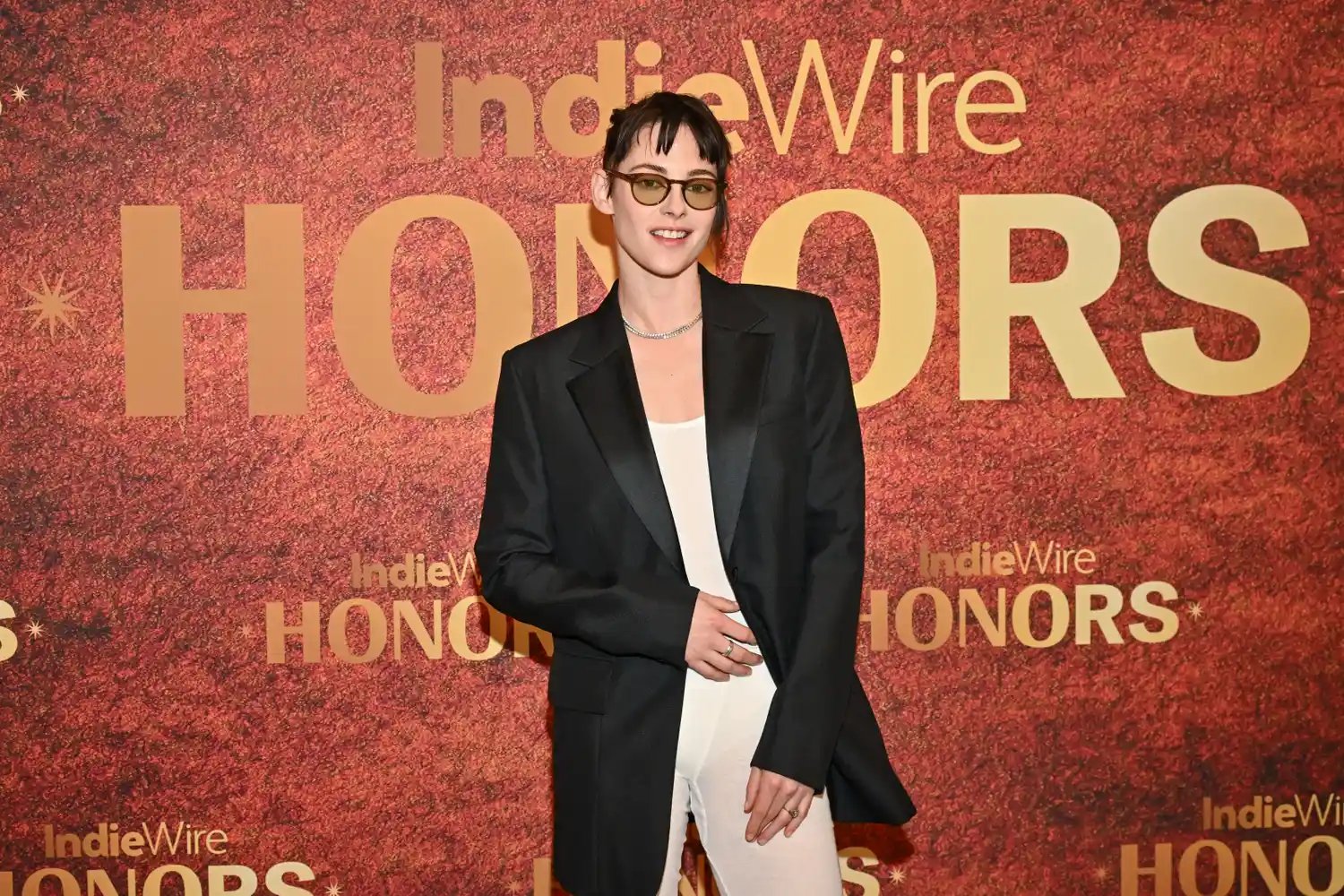 Kristen Stewart in a black blazer and sheer white underwear on the red carpet