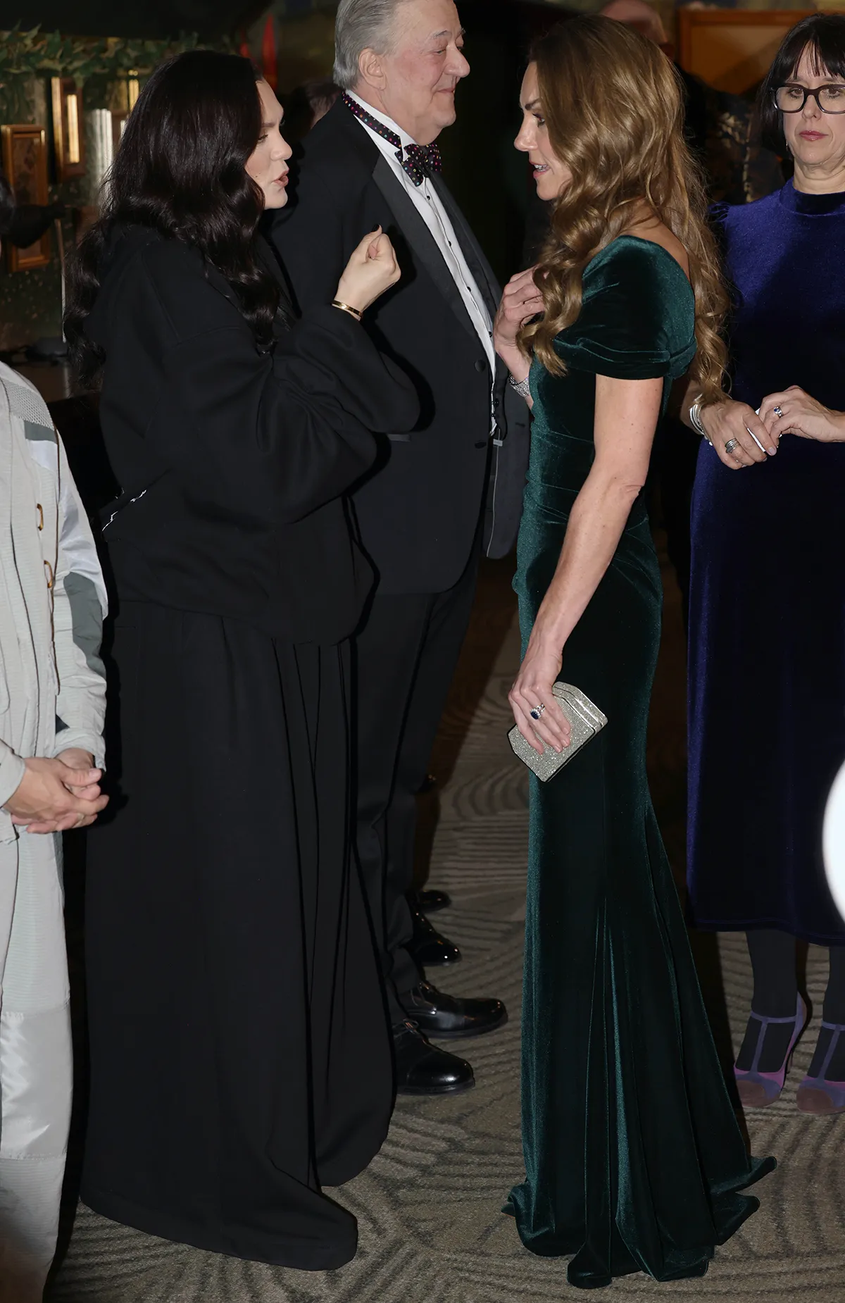 Catherine, Princess of Wales speaks with Jessie J as she meets a number of performers and representatives at the Royal Variety Performance