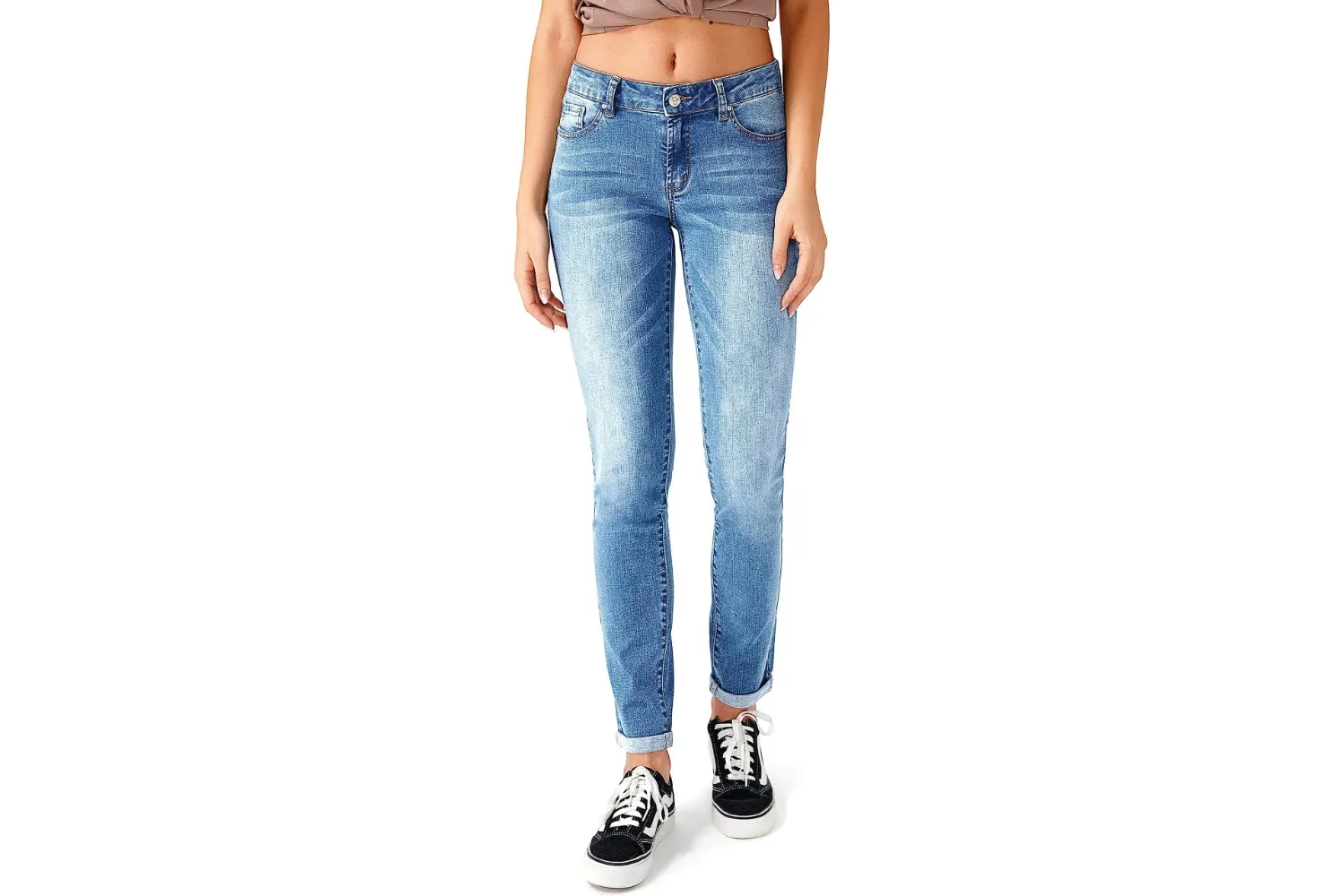 A person wearing distressed skinny jeans