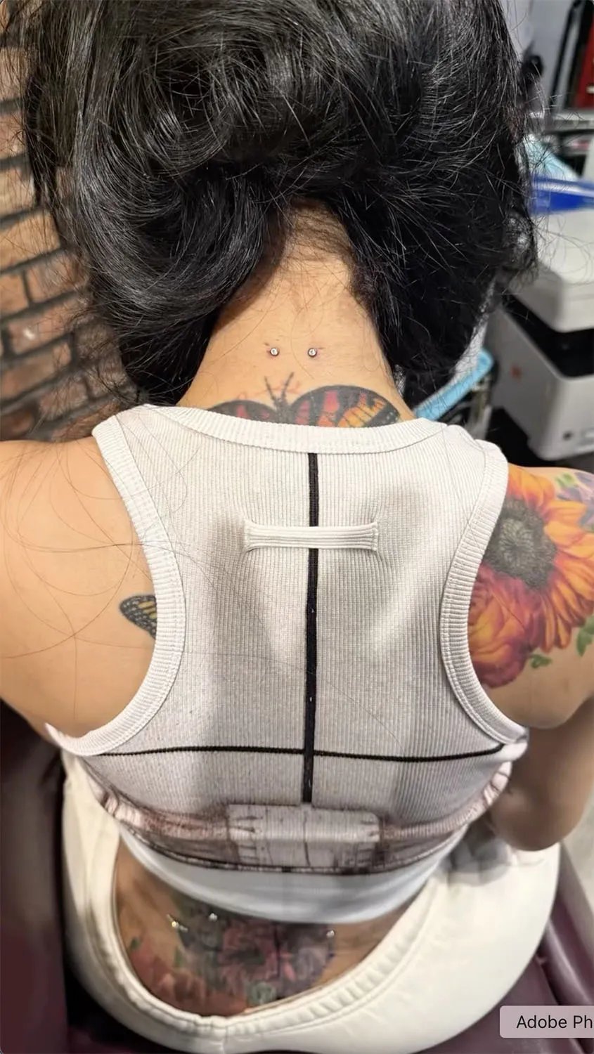 Cardi B's neck piercings.