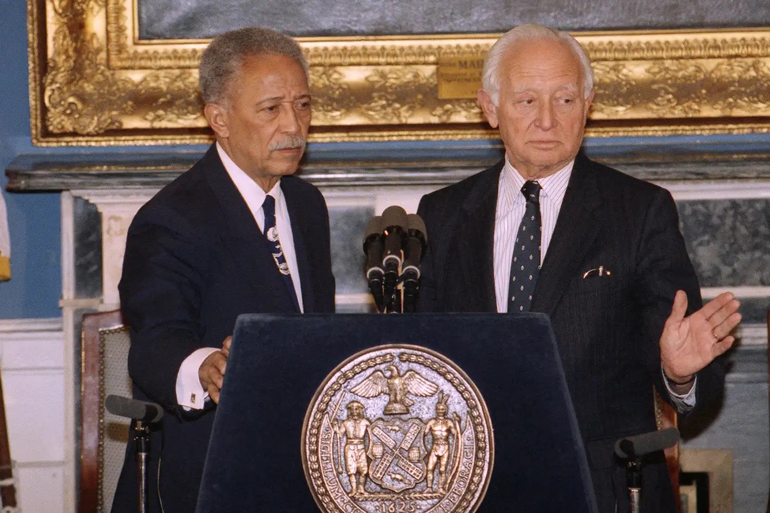 New York City Mayor David Dinkins and Deputy Mayor Milton Mollen release a report on a stampede at City College on January 15, 1992 in New York.