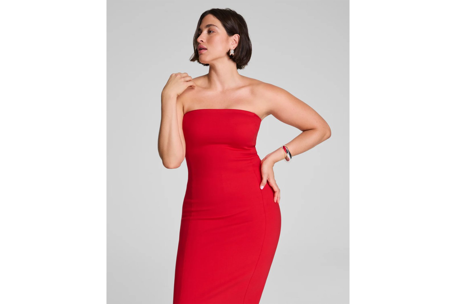 Woman in a strapless red dress.