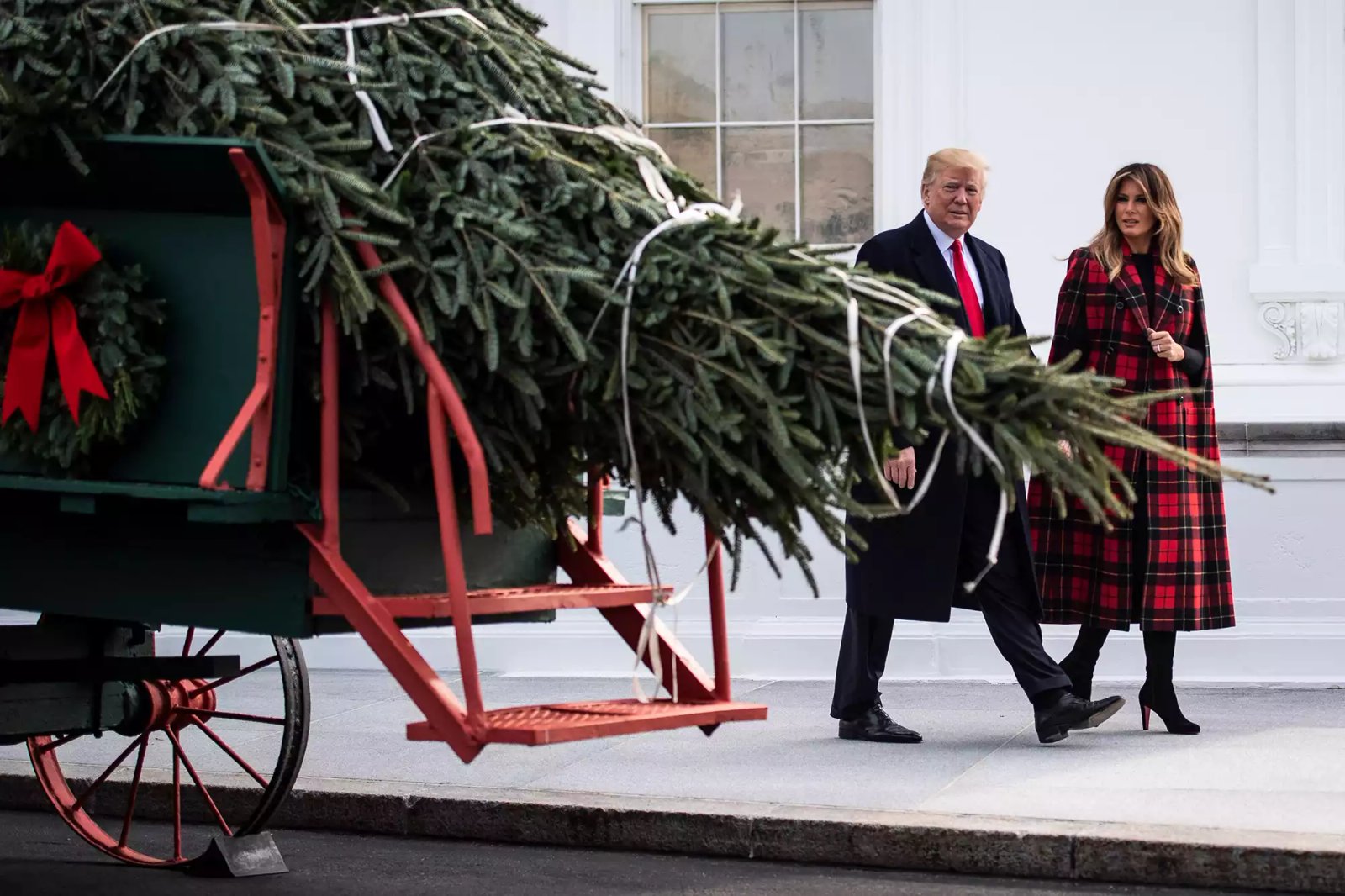 WASHINGTON, DC - NOVEMBER 19 : President Donald J. Trump and first lady Melania Trump view the arrival of the White House Christmas tree at the North Portico of the White House on Monday, Nov. 19, 2018 in Washington, DC. (Photo by Jabin Botsford/The Washington Post via Getty Images)