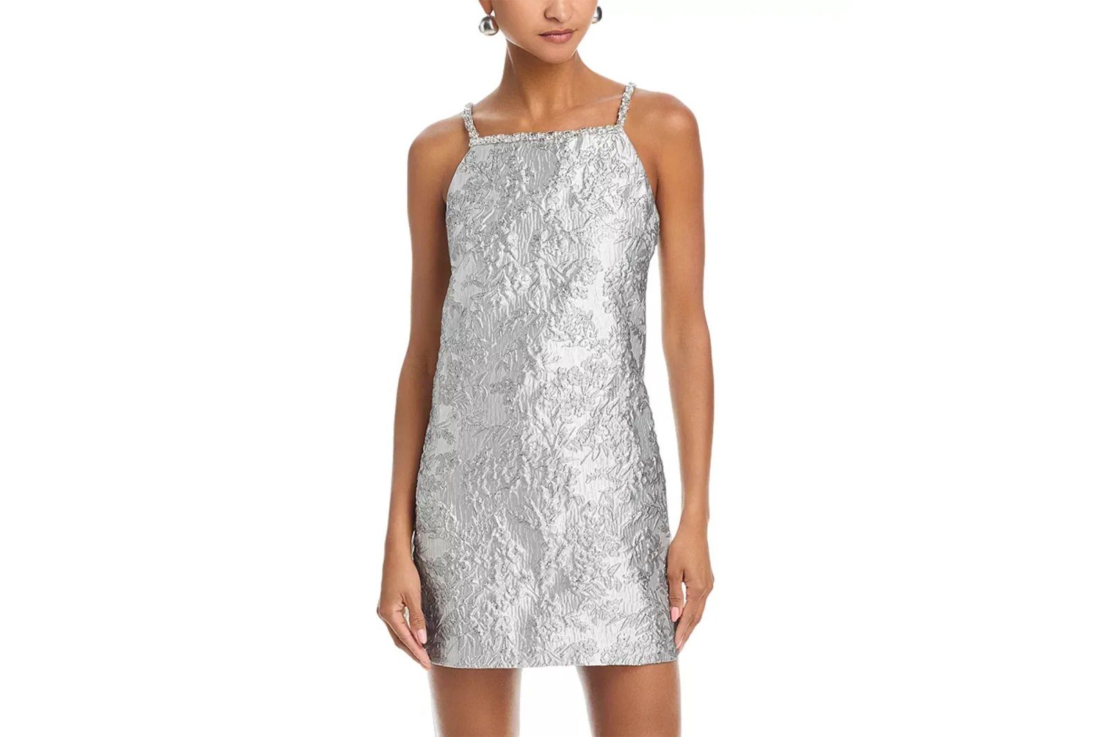 A silver brocade mini dress with crystal straps.
