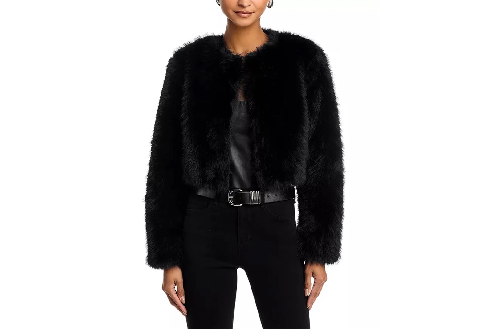 A woman wearing a black faux fur cropped jacket.
