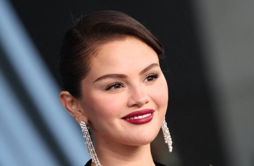 Selena Gomez Shines in a Festive Lace-Trimmed Little Black Dress and Sheer Black Tights