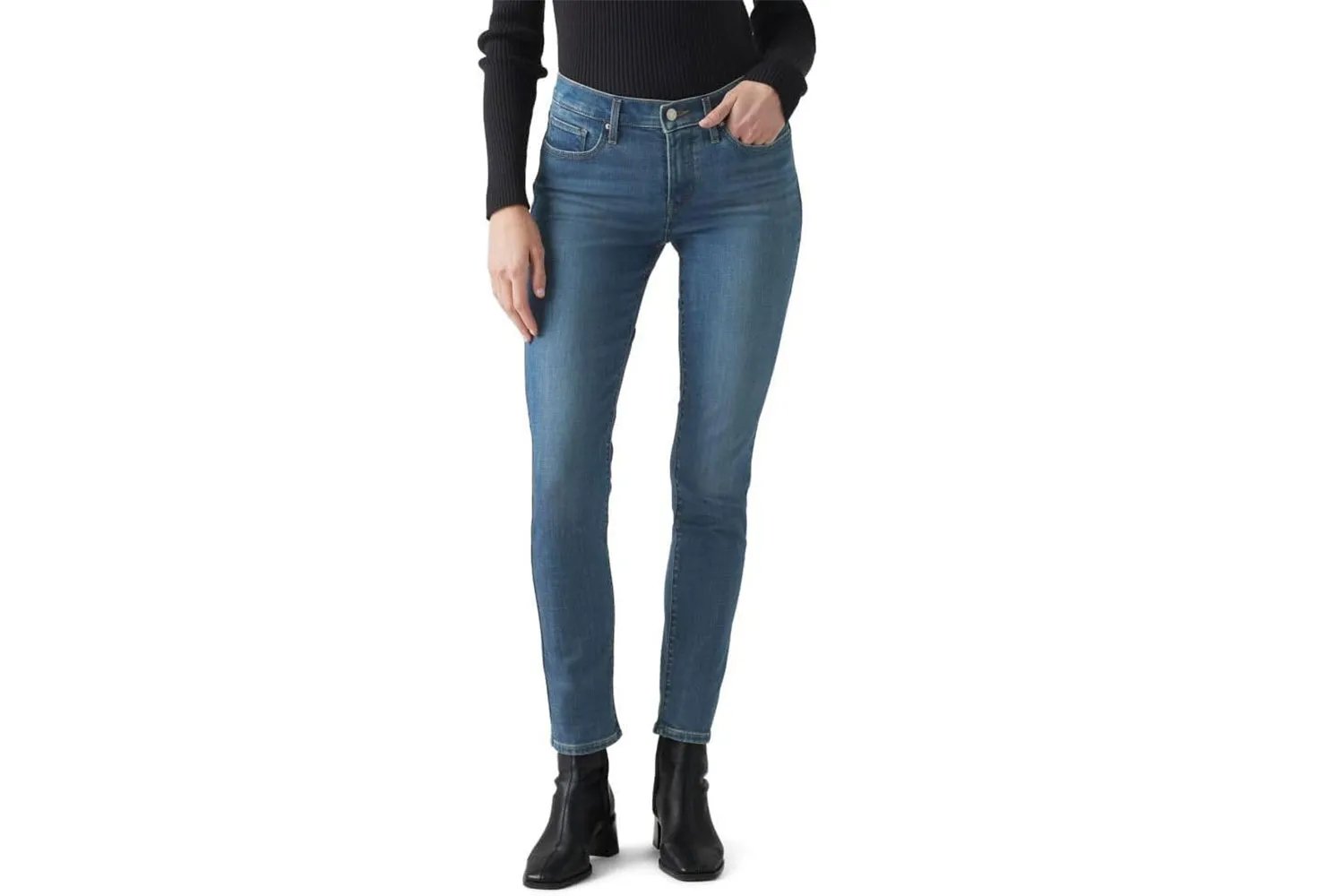 Person modeling Levi’s 311 skinny jeans and black boots
