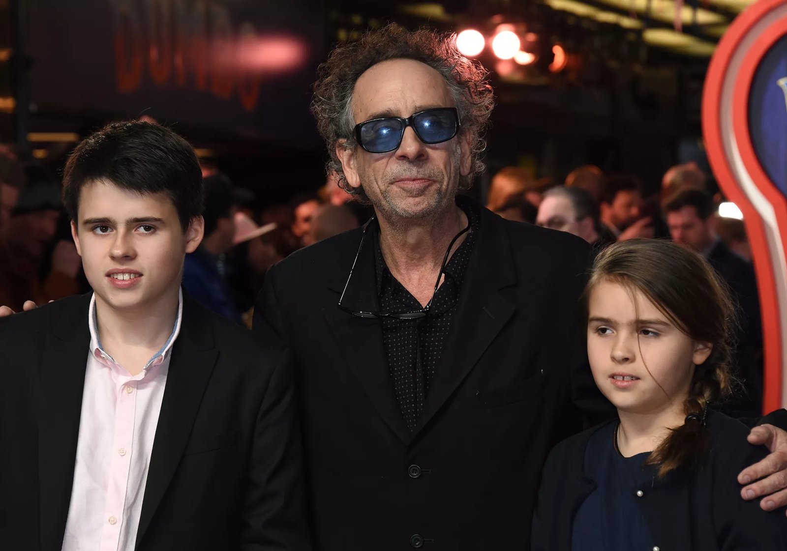 Tim Burton, with children Billy and Nell, attend the 'Dumbo' European premiere on March 21, 2019, in London, England.