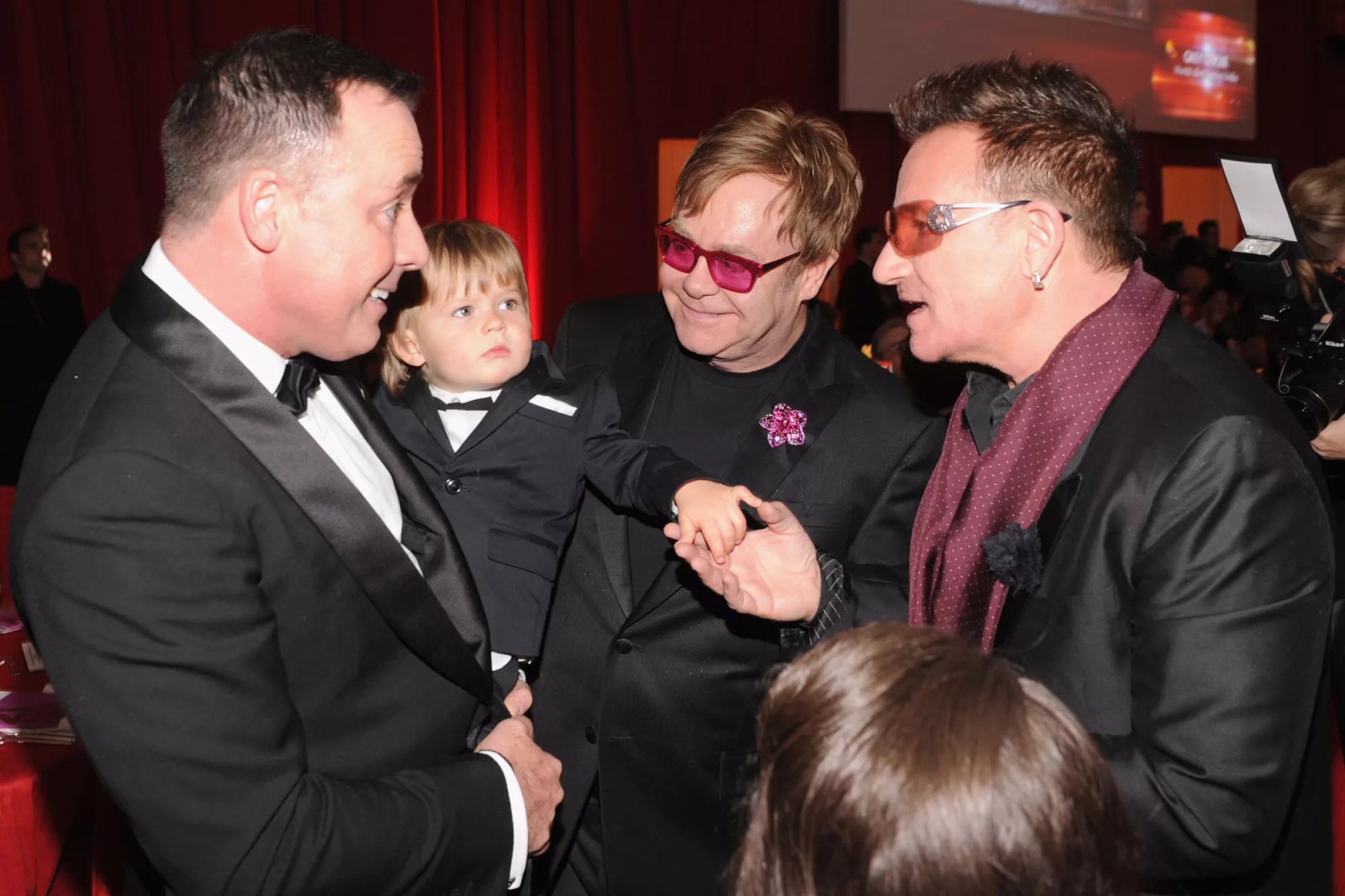 David Furnish, Zachary Furnish-John, Sir Elton John, and Bono