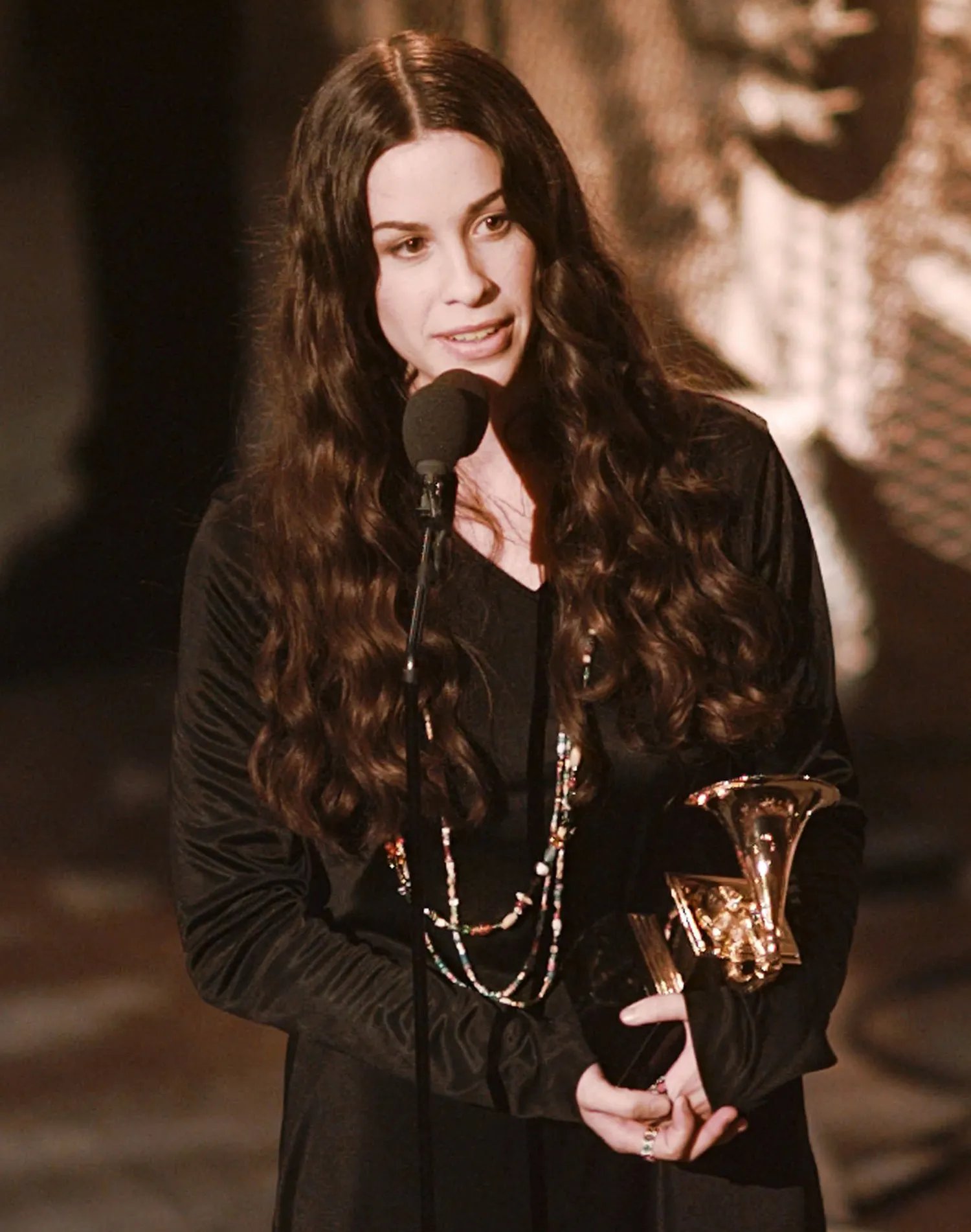 Alanis Morissette thanks her producers after winning the "Album of the Year" at the 38th annual Grammy Awards at the Shrine Auditorium in Los Angeles Wednesday, Feb. 28, 1996