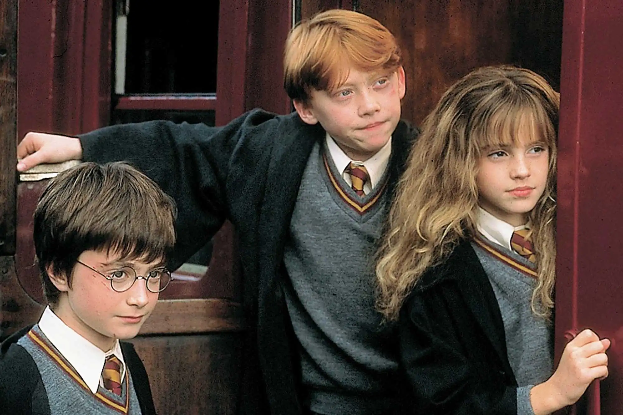 Daniel Radcliffe, Rupert Grint and Emma Watson in Harry Potter and the Sorcerer's Stone (2001)