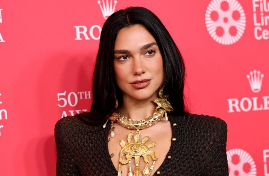 Dua Lipa Stuns in a Bold Red Sequin Outfit with Chic Cutouts and Matching Gloves