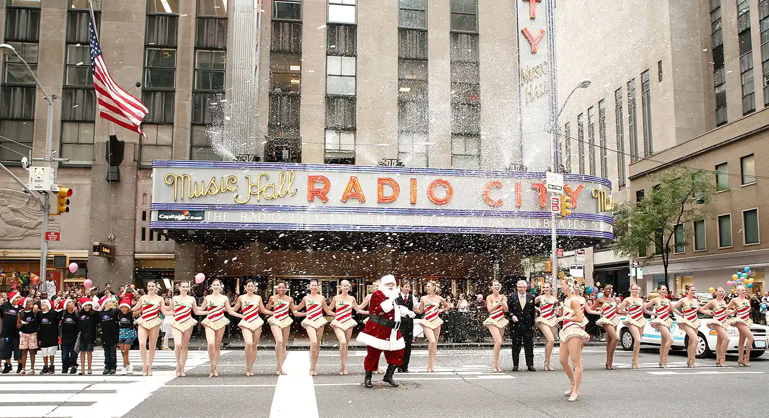 Charles Edward Hall, The Radio City Rockettes and James Covington perform during the 2010 Radio City Christmas Spectacular Kick Off at Radio City Music Hall on August 12, 2010, in New York City.