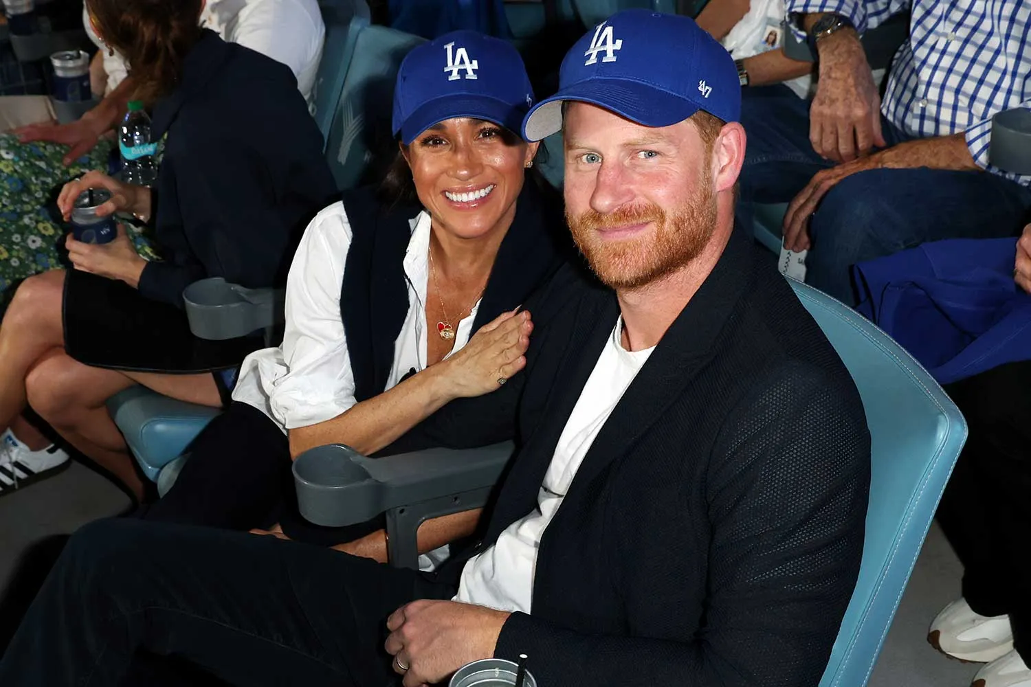 Prince Harry, Duke of Sussex and Meghan, Duchess of Sussex pose for a photo during Game Four of the 2025 World Series presented by Capital One between the Toronto Blue Jays and the Los Angeles Dodgers at Dodger Stadium on Tuesday, October 28, 2025 in Los Angeles, California.