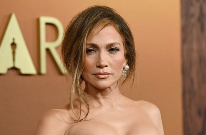 Jennifer Lopez Stuns in a Daring White Gown with a thigh-high Slit for New Year’s Eve