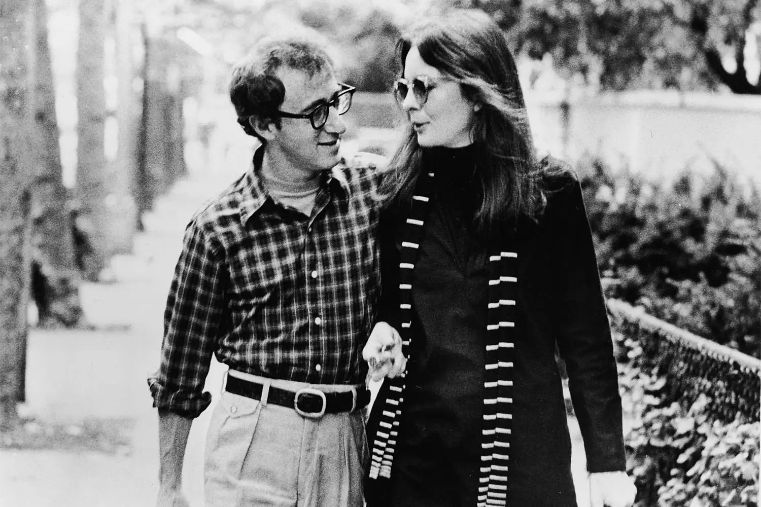 Diane Keaton and Woody Allen walk along a street and talk in a scene from 'Annie Hall,' directed by Allen, New York, New York, 1977
