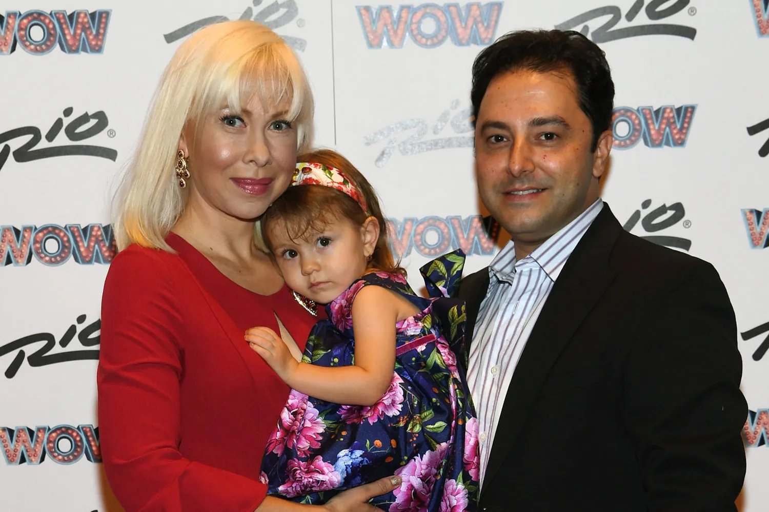 Oksana Baiul, Carlo J Farina, and their daughter arrive at "WOW - WORLD OF WONDER" premiere at Rio All-Suite Hotel & Casino on October 7, 2017