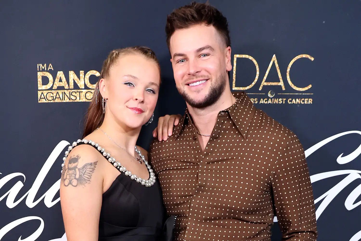 Jojo Siwa and Chris Hughes attend Dancers Against Cancer's 2025 Gala Of The Stars at The Beverly Hilton on October 21, 2025 in Beverly Hills, California.