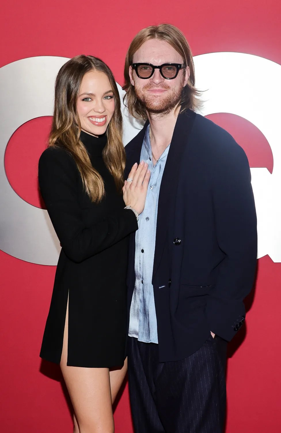 Claudia Sulewski and Finneas arrive at the 2025 GQ Men Of The Year at Chateau Marmont on November 13, 2025 in Los Angeles, California.