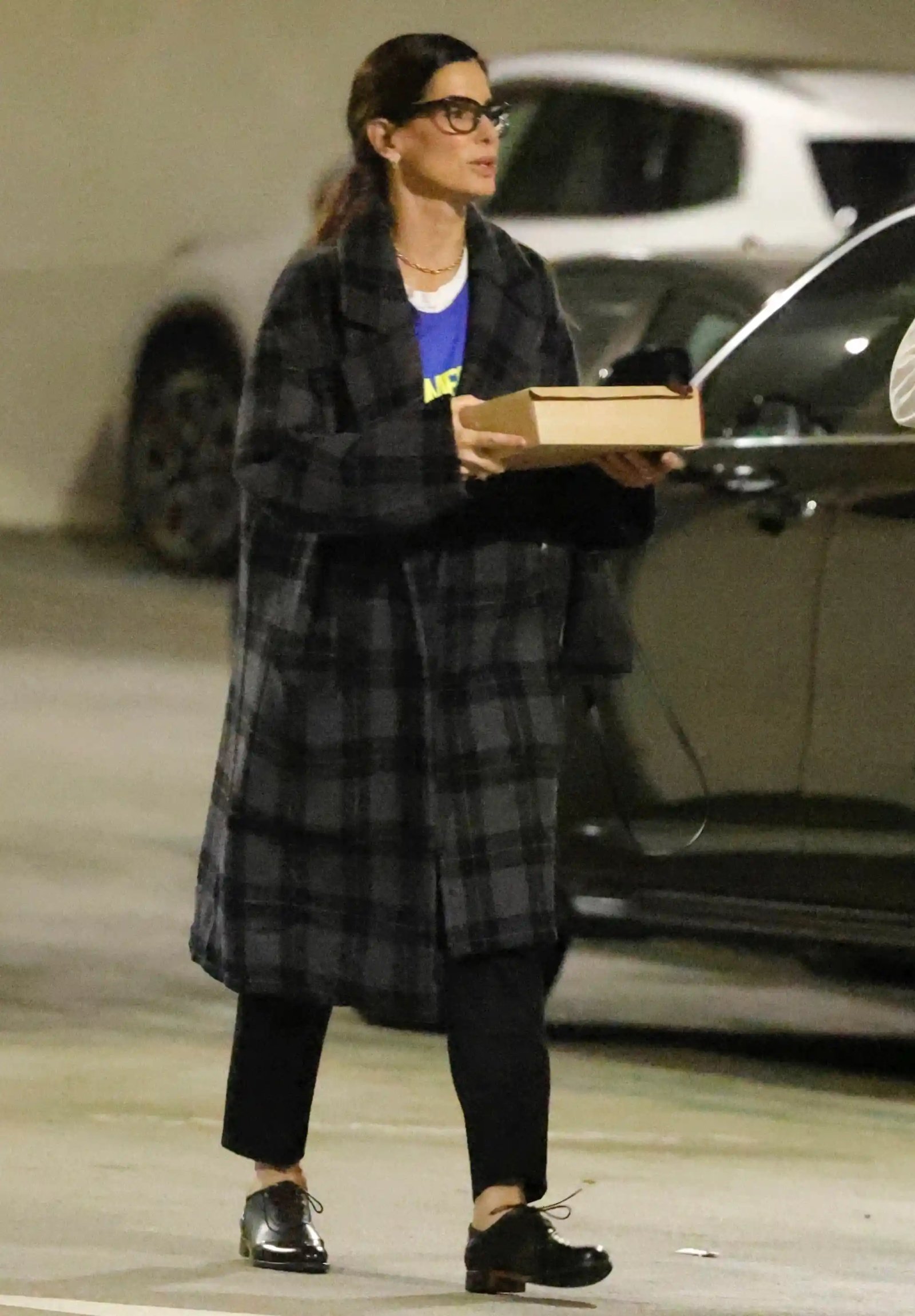Sandra Bullock was seen in Los Angeles flashing a brief smile as she left a meeting with friends