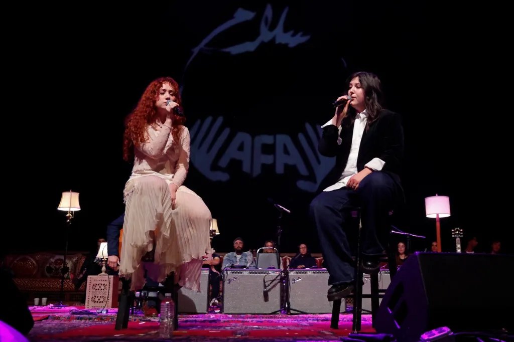 Lucy Dacus and Chappell Roan Perform a Heartfelt Cover of 'The Book of Love' at Artists for Aid Benefit Show