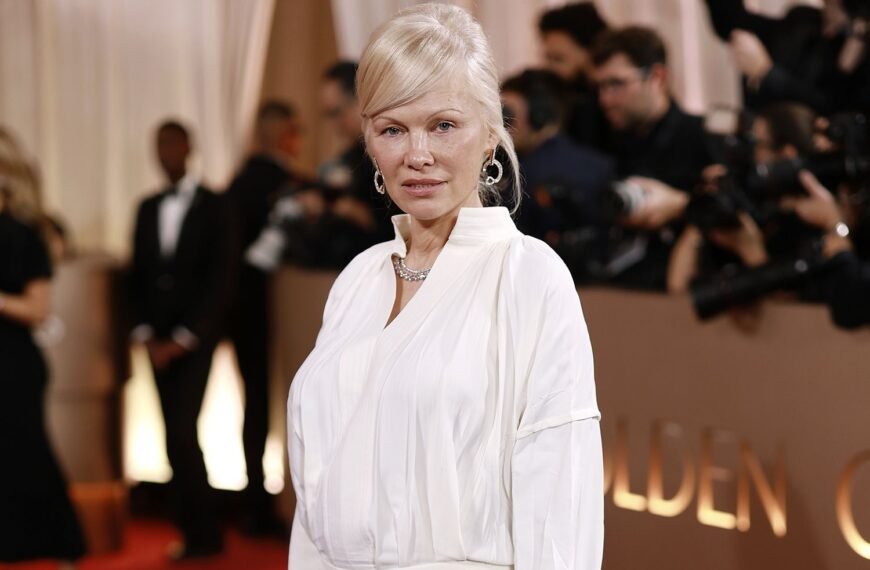 Pamela Anderson Shines in a White Button-Down and Stunning Diamonds at the 2026 Golden Globes