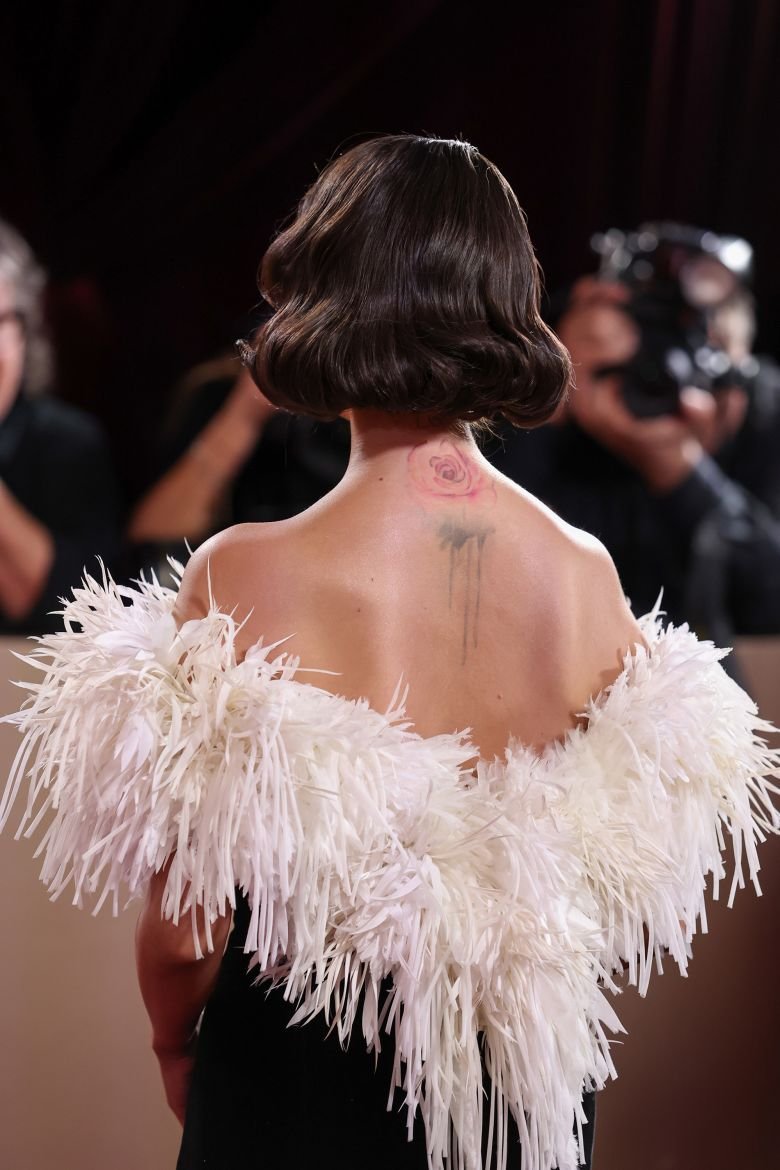 The neckline blossomed with feathers.