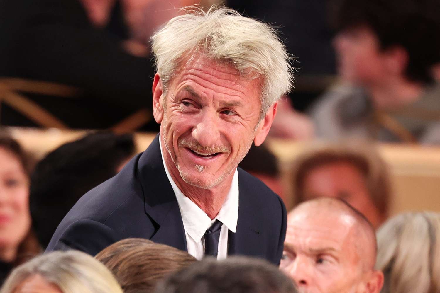 Sean Penn Caught Smoking at His Table During the Golden Globes Event