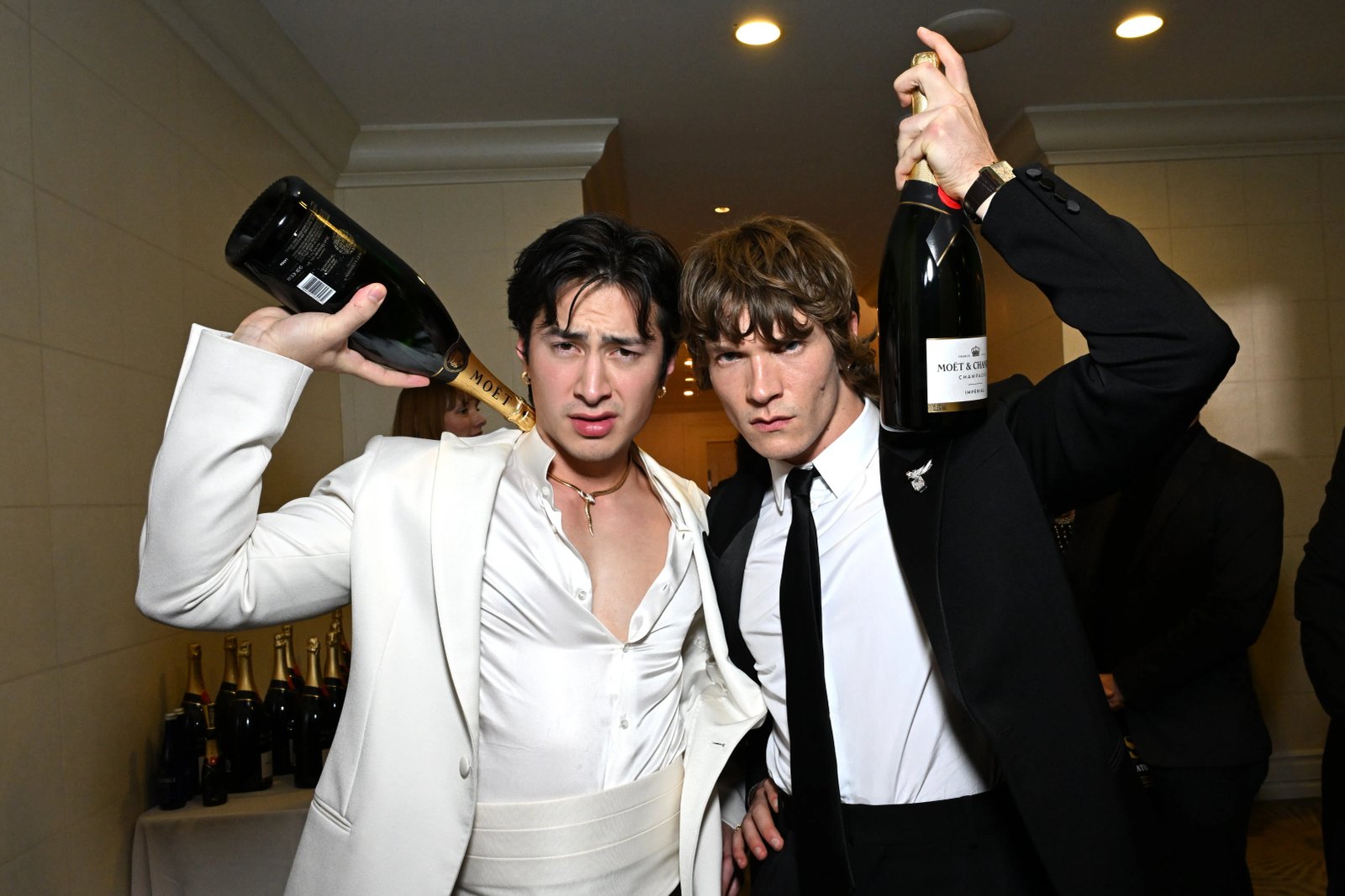 Hudson Williams and Connor Storrie pose at the Golden Globes.