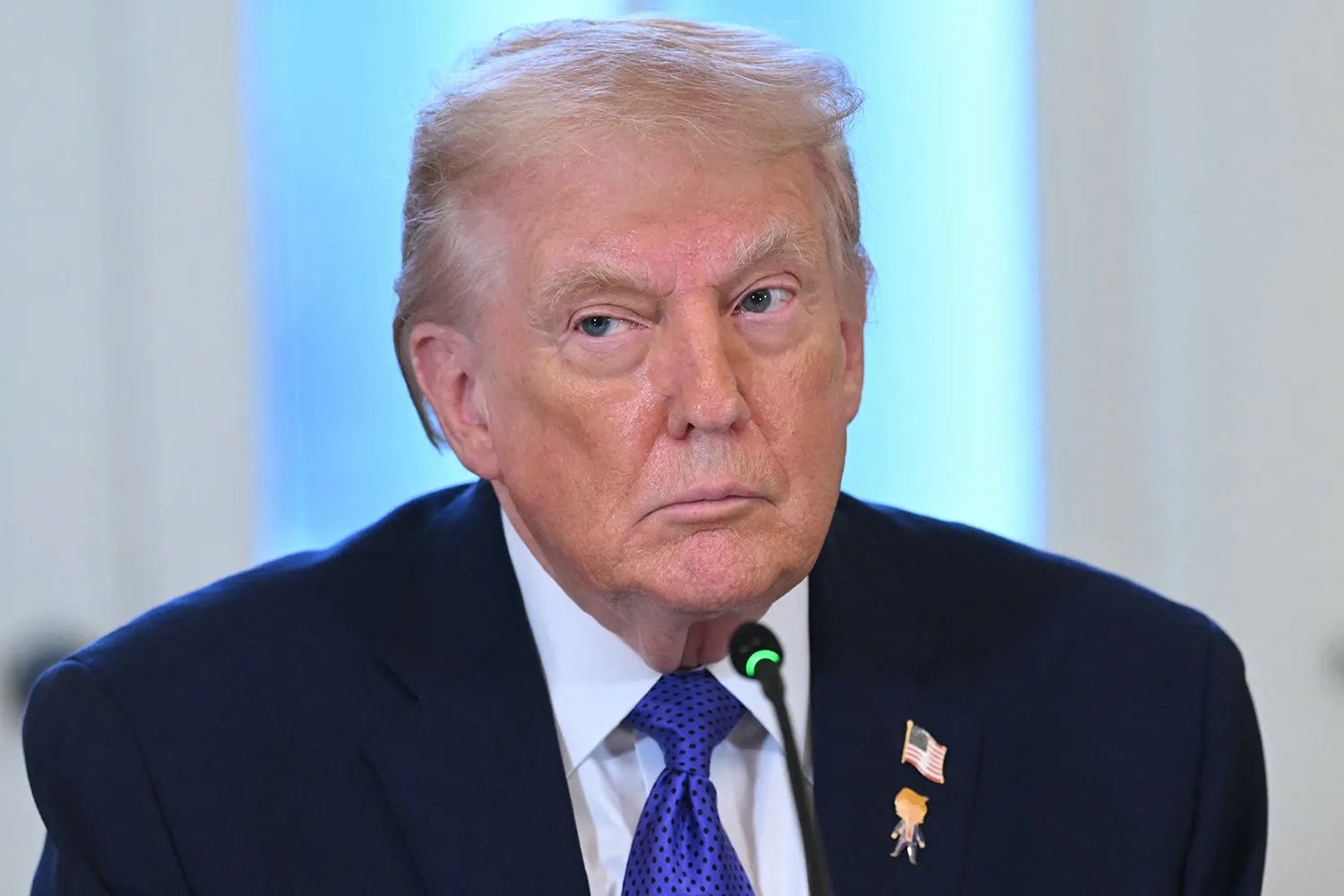 President Donald Trump looks on during a meeting with US oil companies executives in the East Room of the White House in Washington, DC on January 9, 2026.