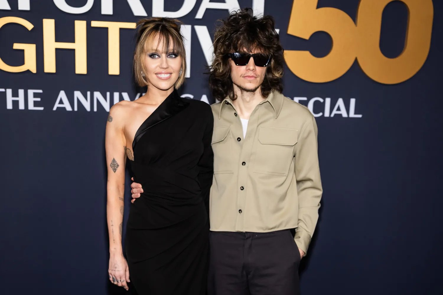 Miley Cyrus and Maxx Morando on the red carpet.