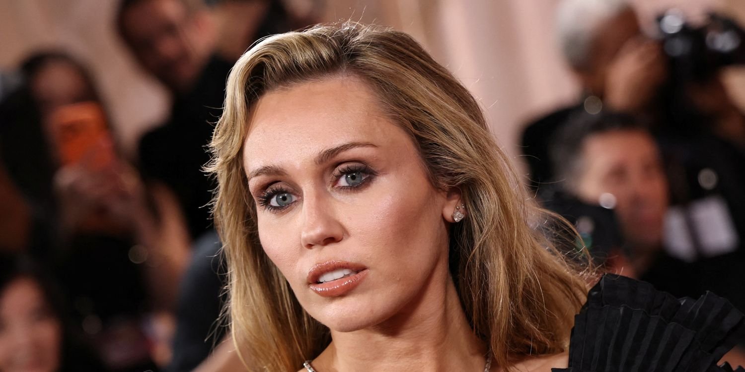 Miley Cyrus Stuns in a Bold One-Shoulder Black Dress with a Chic Leg Slit