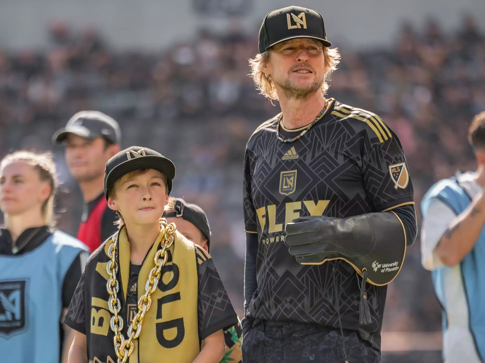 Owen Wilson and son watch falcon fly during a game between Austin FC and Los Angeles FC at Banc of California Stadium on October 29, 2022 in Los Angeles, California