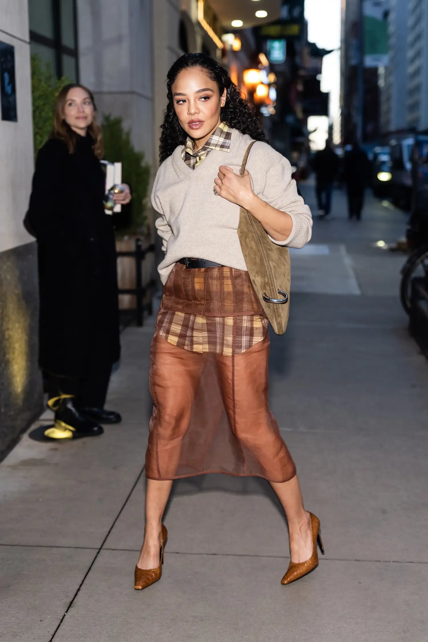 Tessa Thompson in a sheer brown skirt and sweater in New York