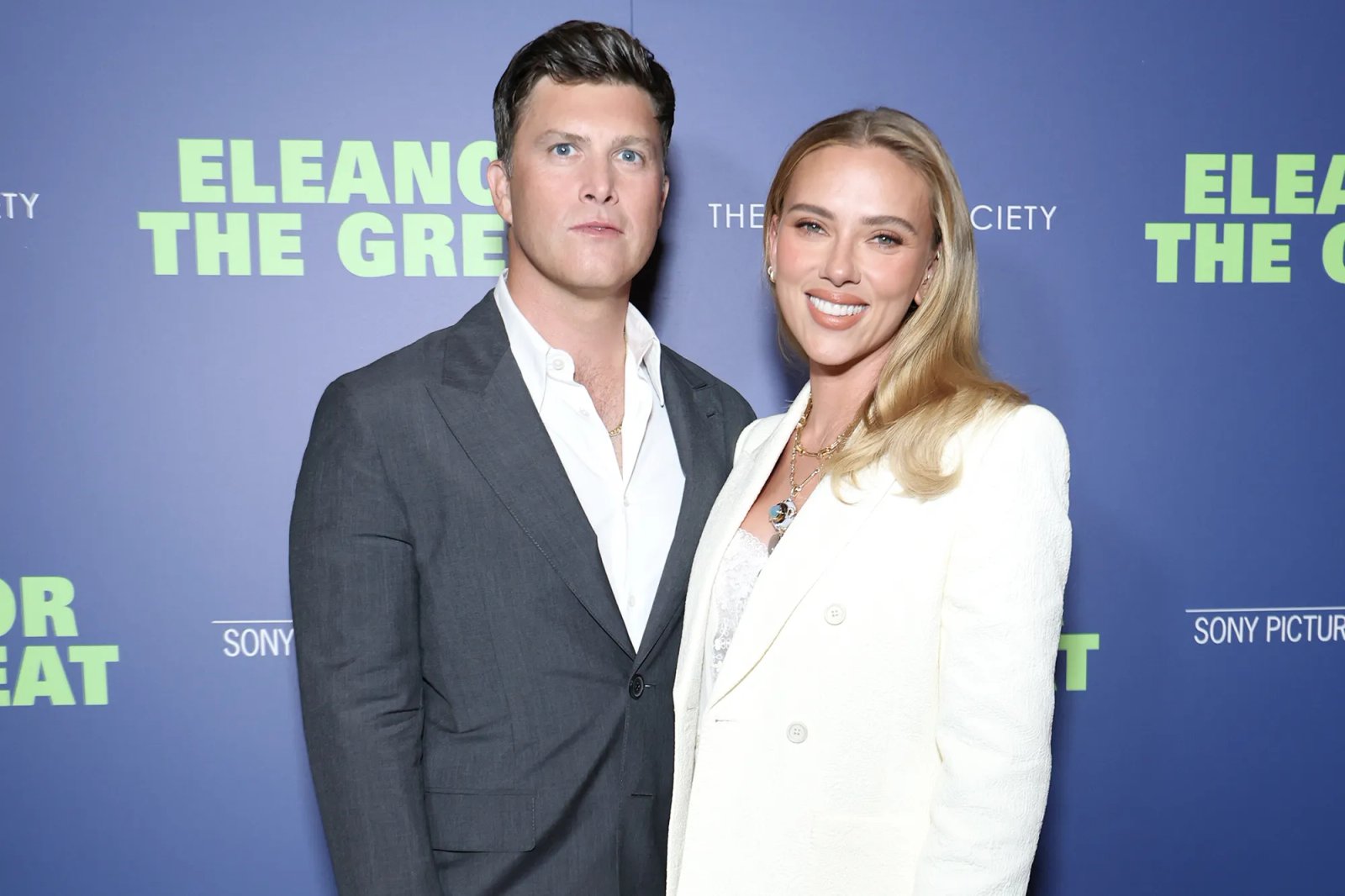 Scarlett Johansson and Colin Jost posing together at an event