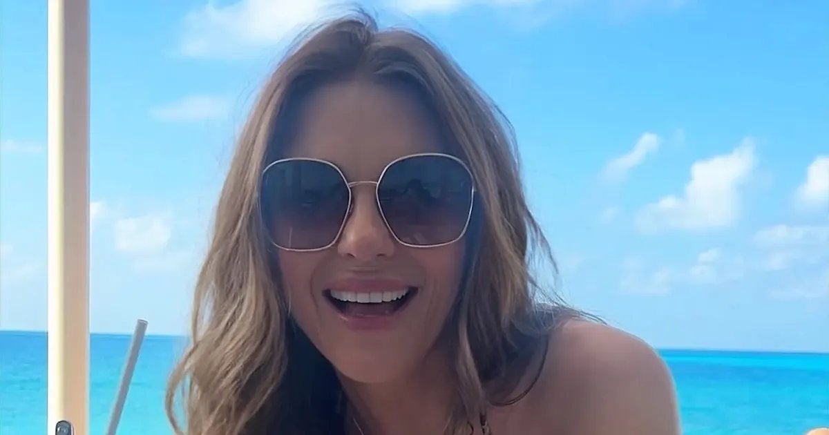 Elizabeth Hurley Shows Off Her Fun Side in a String Bikini and Cozy Bath Photos