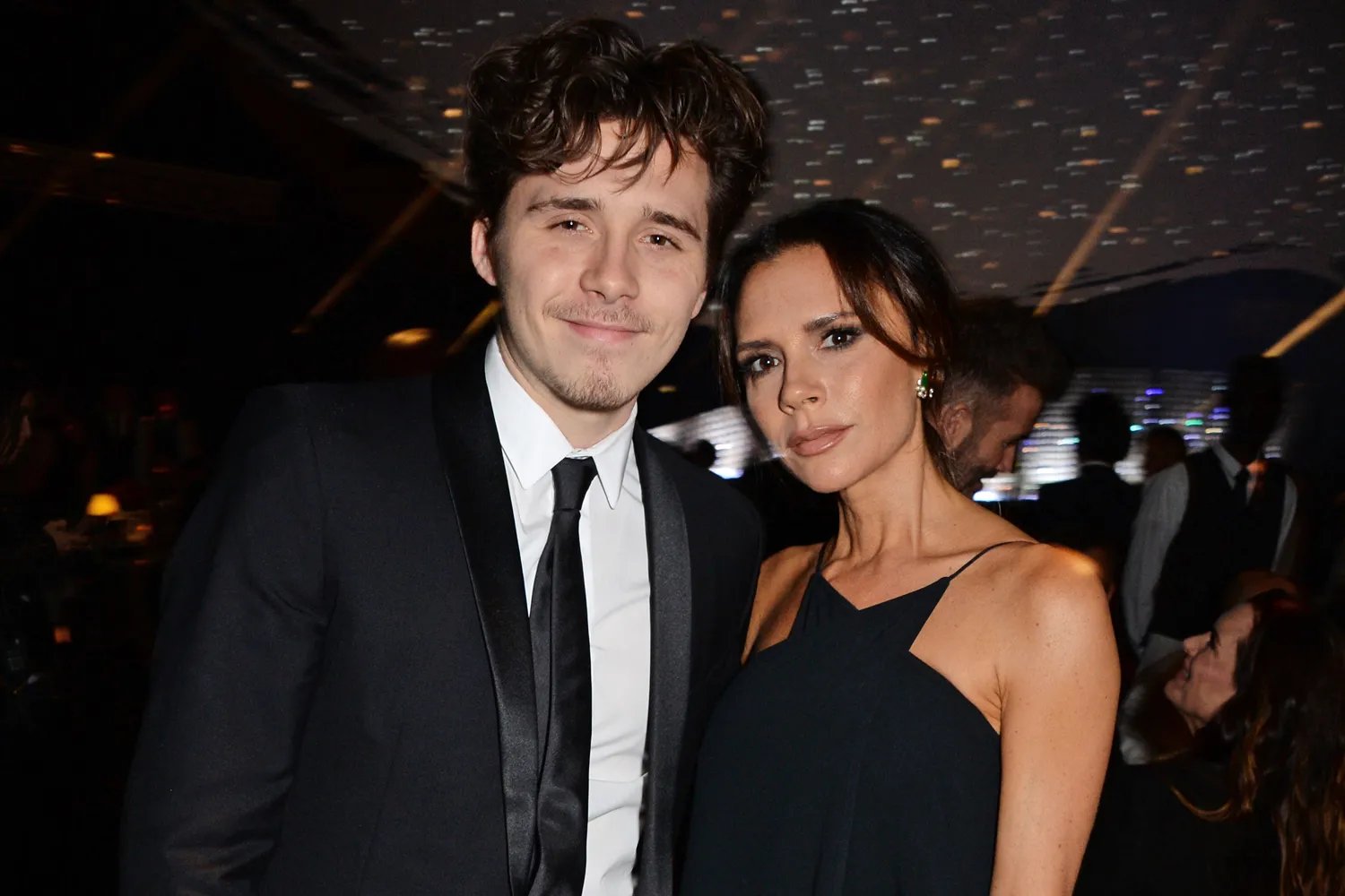 Brooklyn Beckham and Victoria Beckham attend The Fashion Awards 2018 in partnership with Swarovski at the Royal Albert Hall on December 10, 2018 in London, England.