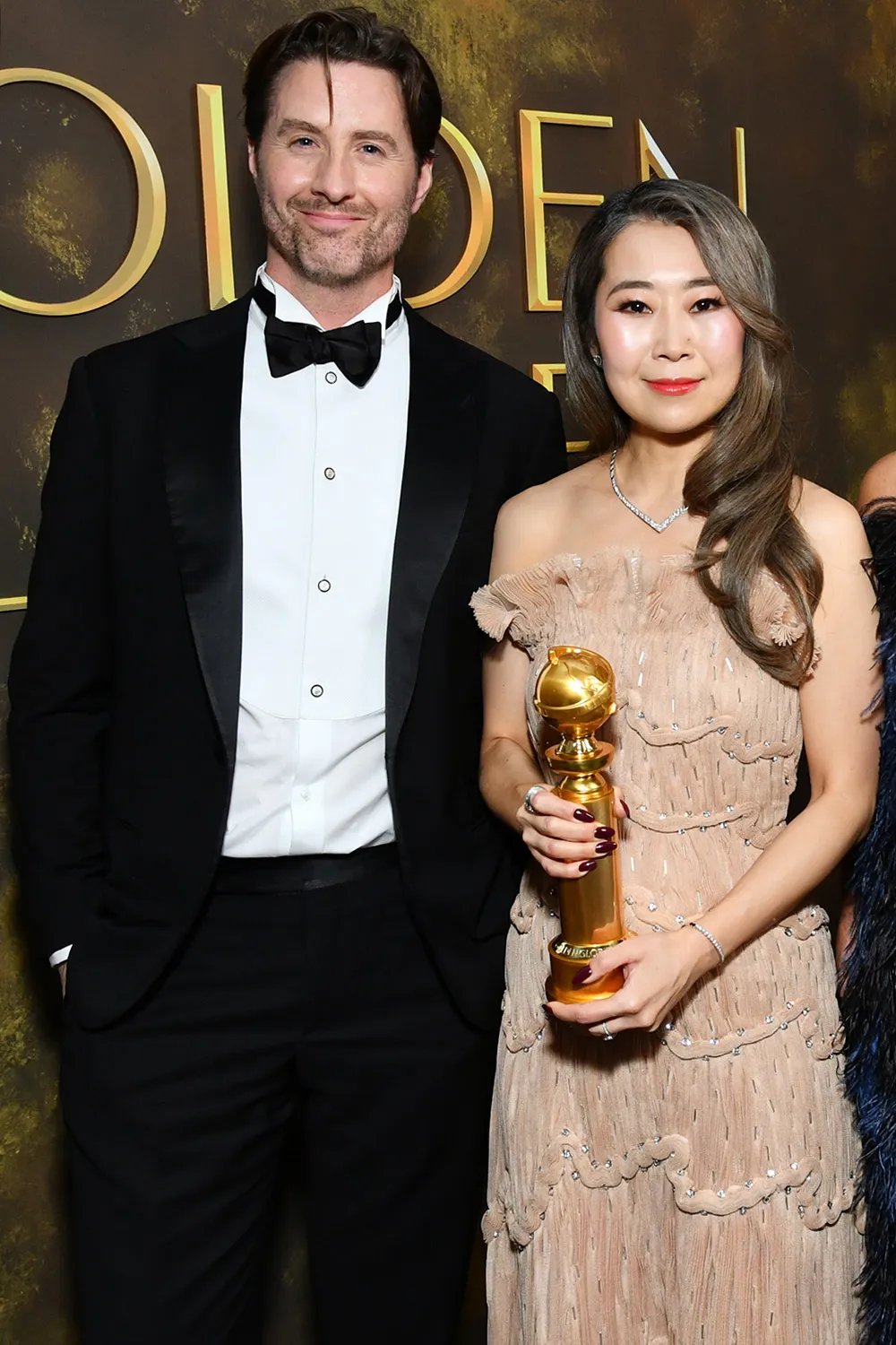 Chris Appelhans, Maggie Kang and Michelle Wong at the 83rd Annual Golden Globes held at The Beverly Hilton on January 11, 2026 in Beverly Hills, California.