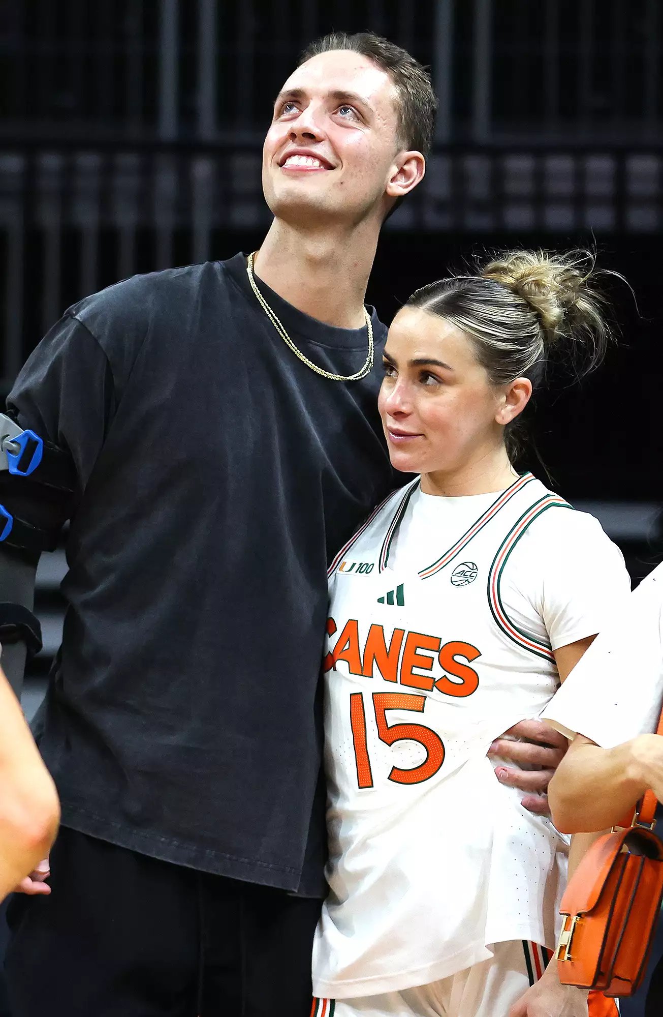 Hanna Cavinder #15 of the Miami Hurricanes and Carson Beck of the Miami Hurricanes