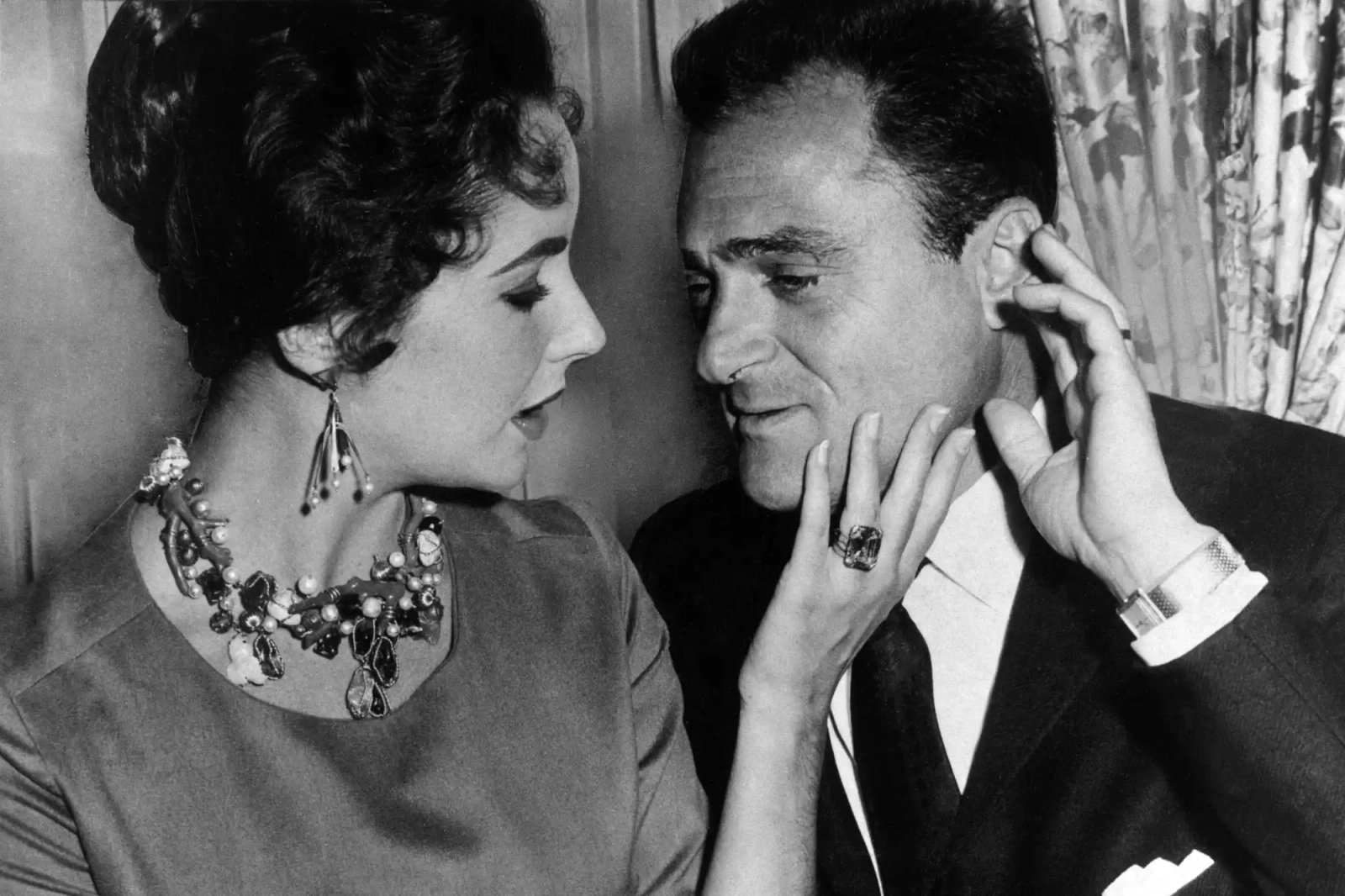 Elizabeth Taylor and Mike Todd as he announces he will buy the Palace Theatre in London.